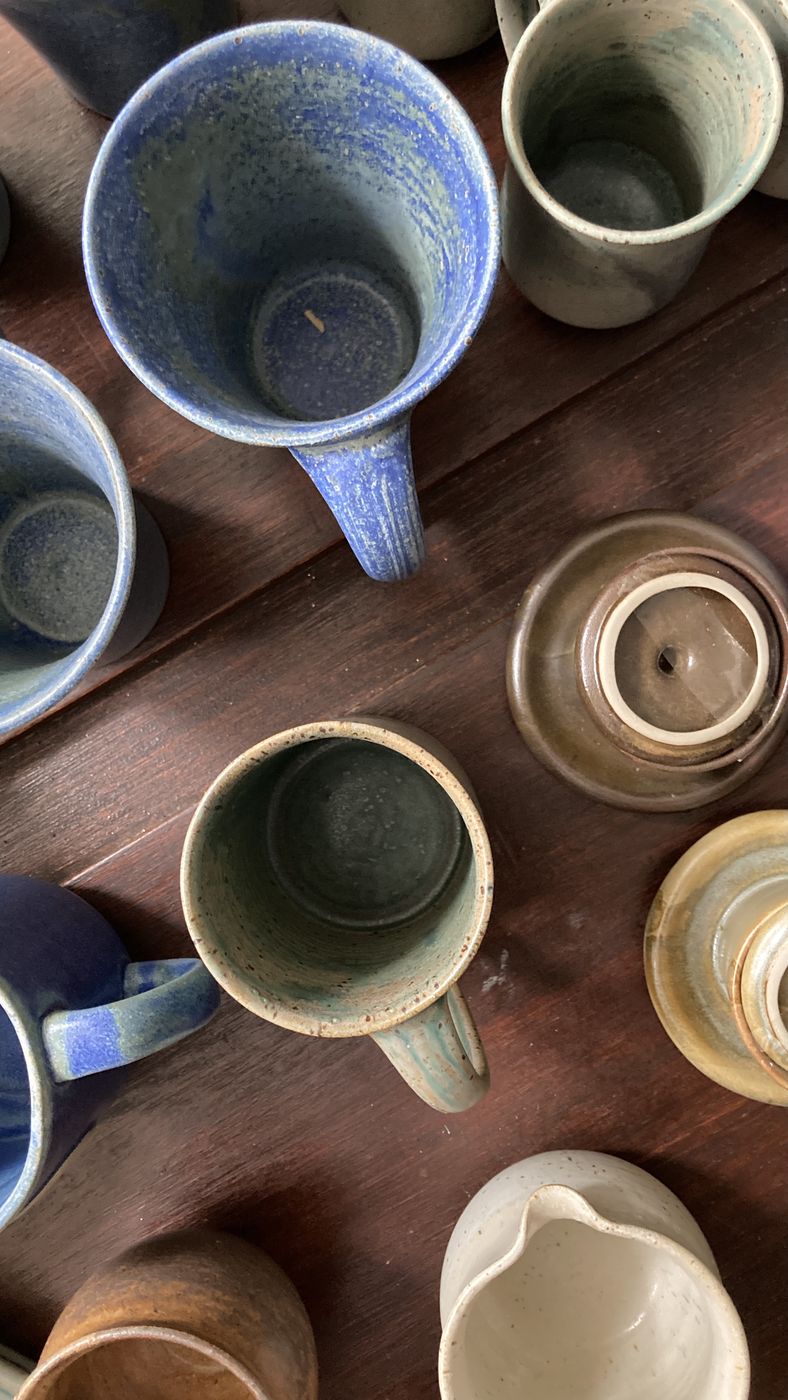 Mugs and a creamer grouped together