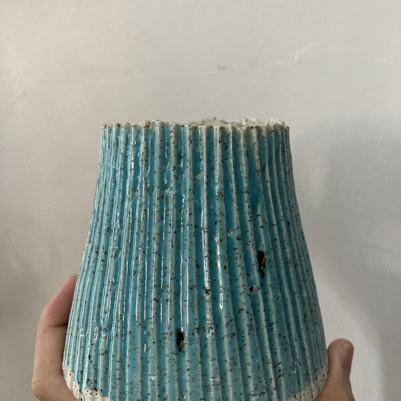 A tall combed barnacle vessel in deep bamboo glaze