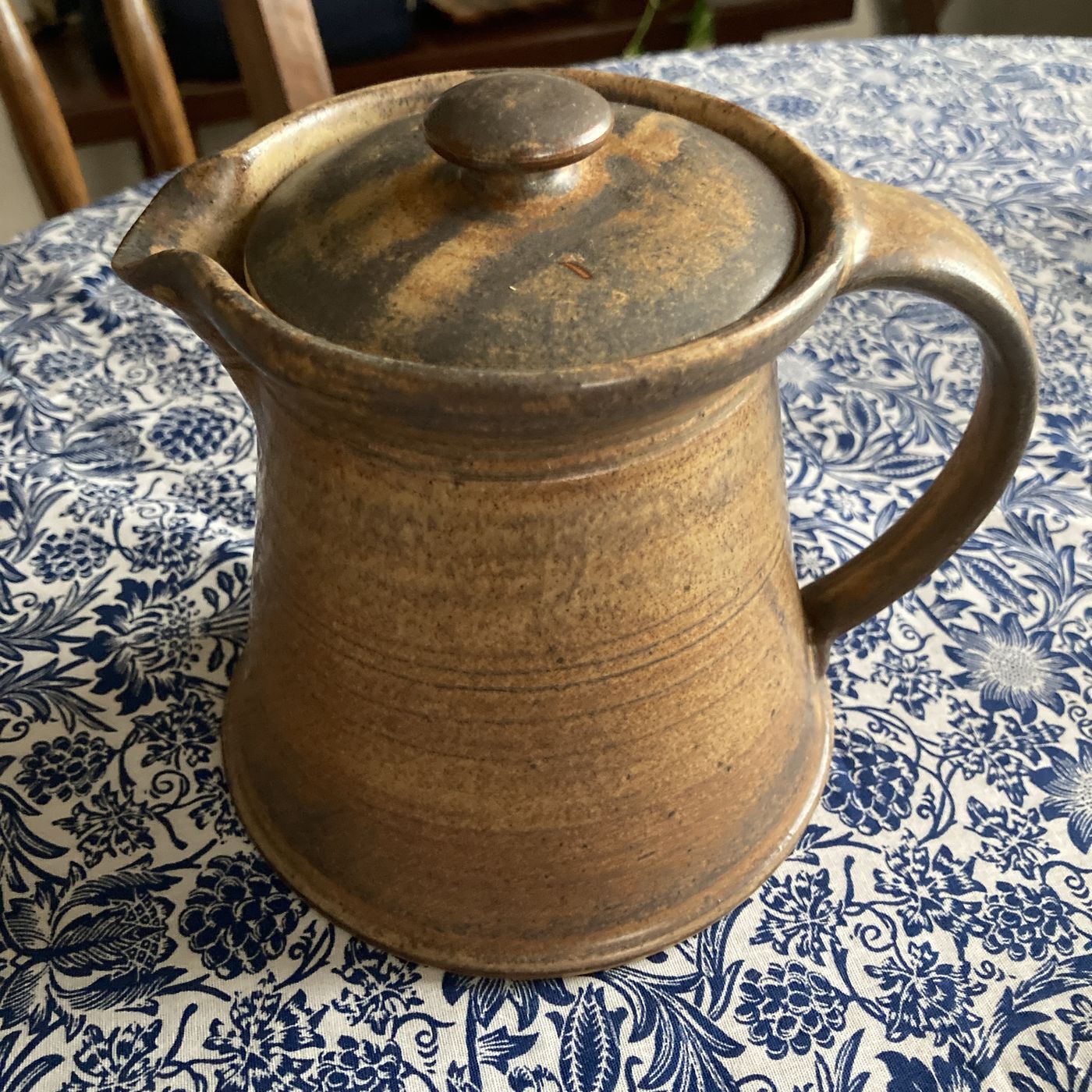 A brown lidded stoneware tea pot